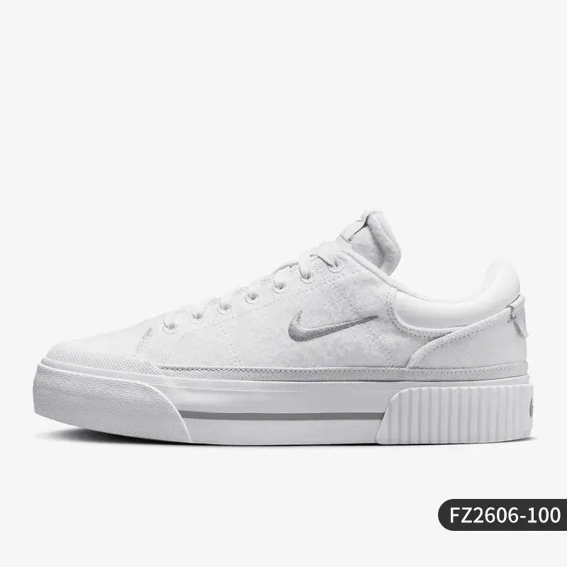 Nike Court Legacy Lift women's casual sneakers in white with a metallic swoosh and raised platform sole.