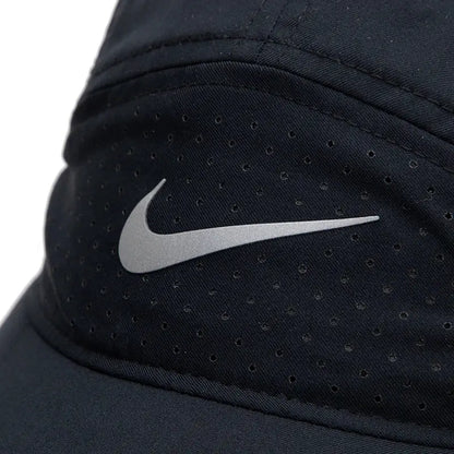 Nike black cap with silver swoosh logo and perforated mesh fabric