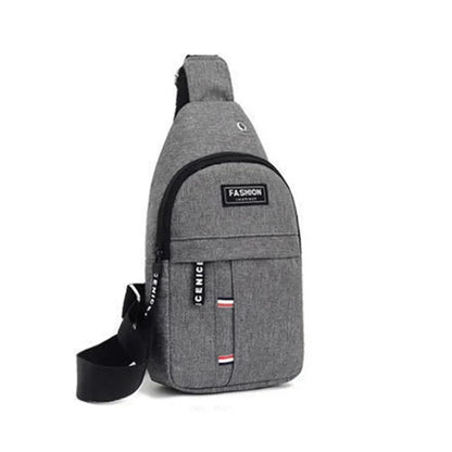 Men's grey crossbody sling bag with adjustable strap, front zipper pocket, striped accents, and a fashion label patch