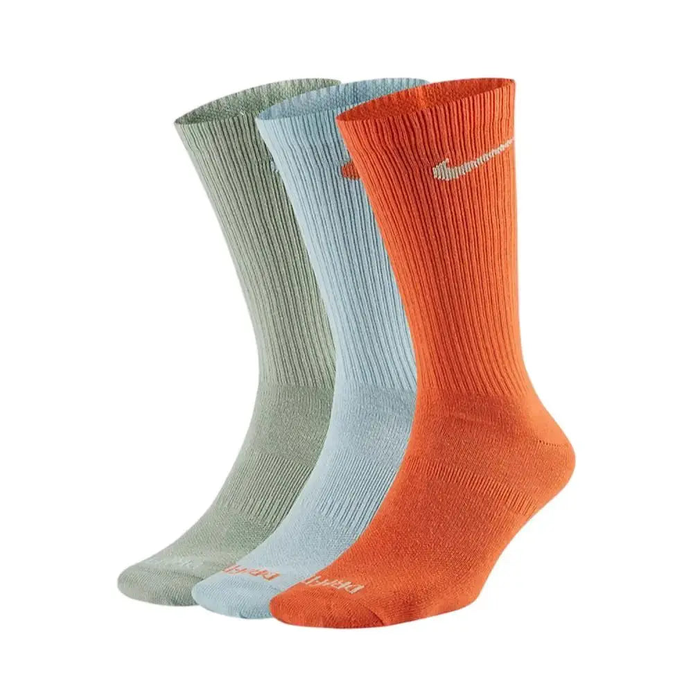 Nike thick-pile terry-sole sports socks 3-pack in olive green, light blue, and orange with Nike swoosh.