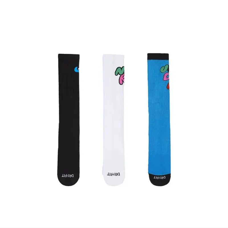 Socks trio: black, white, and blue knee-high DRI-FIT crew socks with small toe logos