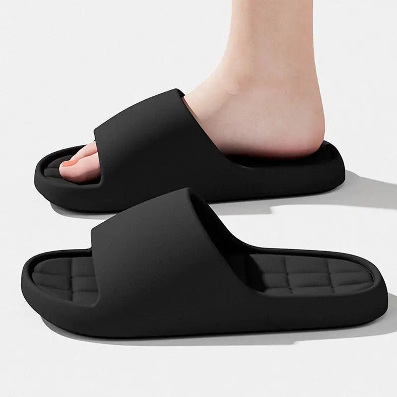 Black unisex slides (2) with cushioned footbeds, lightweight non-slip beach sandals