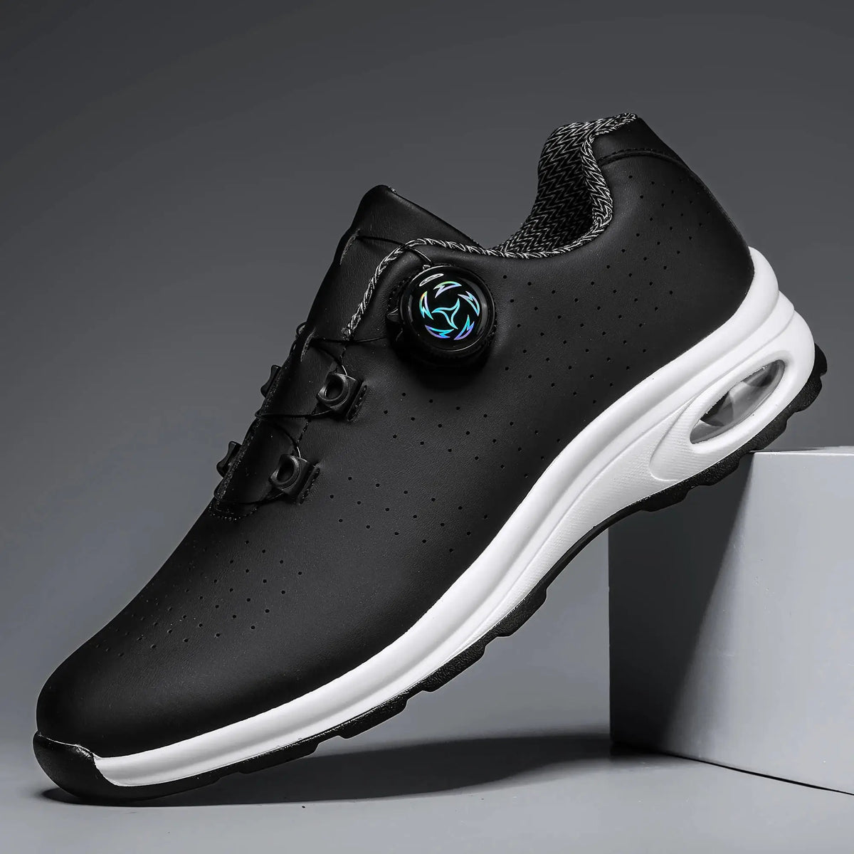 Simple Nen's casual shoes, black perforated upper with white air-cushioned sole and dial closure.