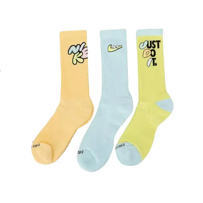 Nike thick-pile terry-sole crew socks set, non-slip and breathable; three pastel socks in yellow, light blue, and lime