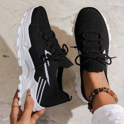 Women's casual lightweight black knit sports shoes with white chunky sole and laces