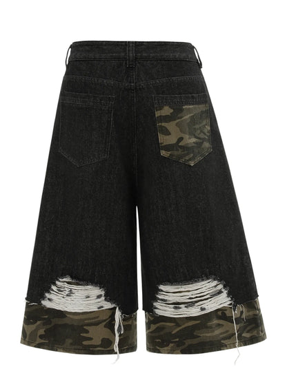 Mens distressed black cotton denim Bermuda shorts with camouflage pocket, camo trim, and ripped hems