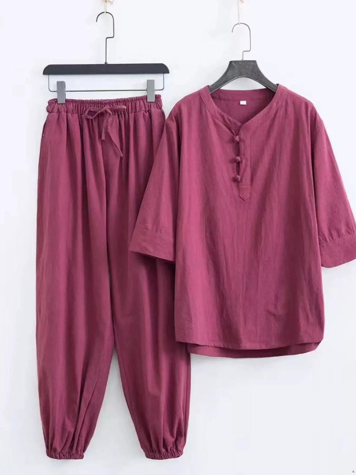 Men's plus-size Chinese-style pajama set in maroon; top with mandarin collar, knot buttons, pants with drawstring.