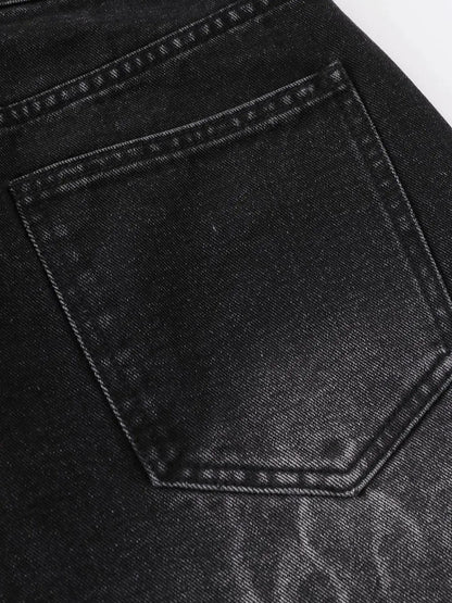 Men's dark denim shorts back pocket close-up with contrast stitching