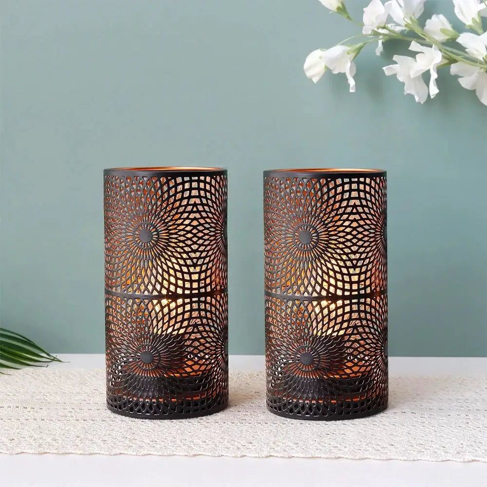 Battery powered table lamps by JHY DESIGN, set of 2; black cylindrical lanterns with intricate metal lattice.