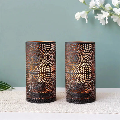 Battery powered table lamps by JHY DESIGN, set of 2; black cylindrical lanterns with intricate metal lattice.