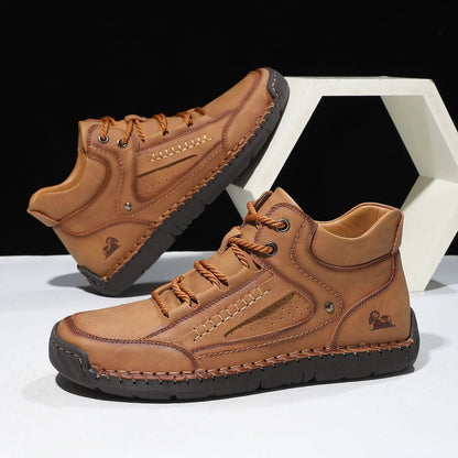 Mens comfortable and breathable flat-laced high-top shoes from AdTec; tan leather upper with black sole.