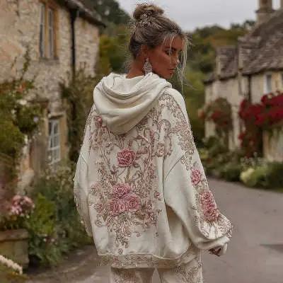 Hooded women's cream hoodie with pink floral print, back view