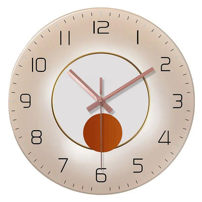 Wall-mounted decorative clock with rose-gold hands, beige-gold bezel, and central orange disk.