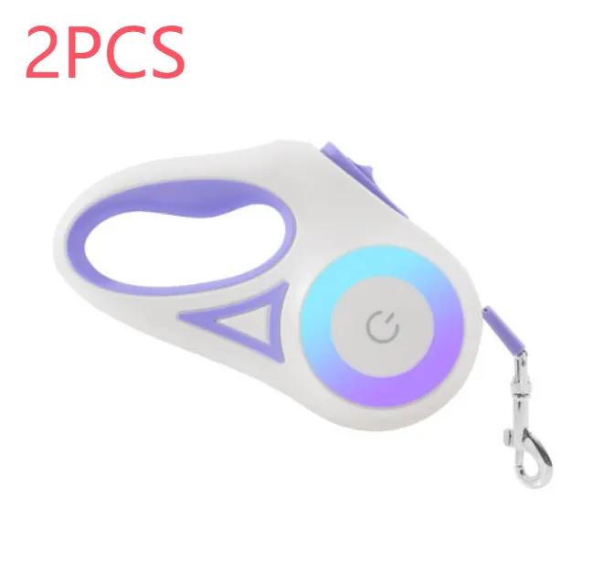 Retractable dog leash with white and purple handle, LED ring, and metal clip