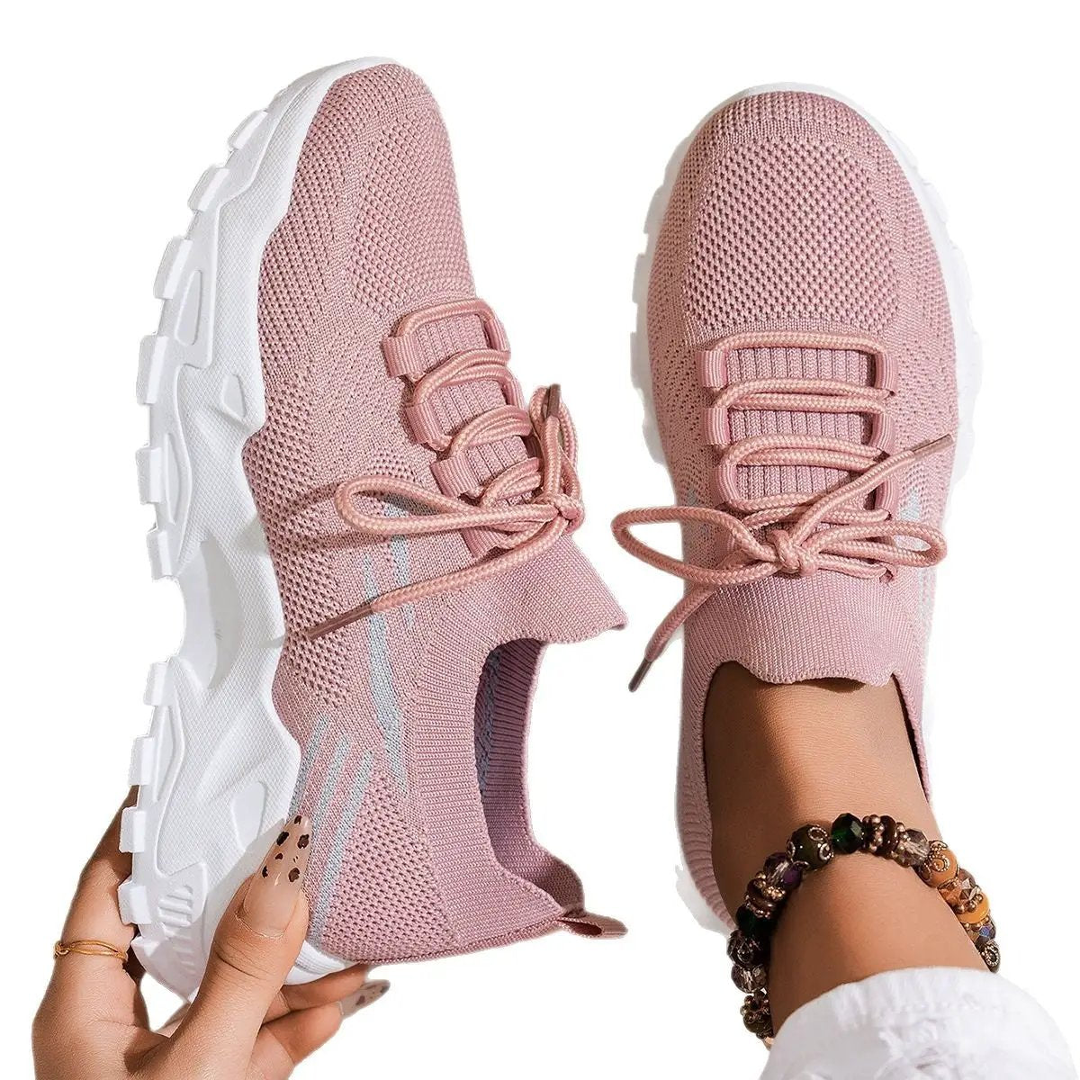 Women's pink knitted sport shoes with chunky white sole and laces