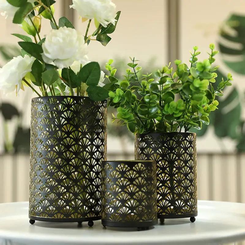 JHY DESIGN Metal hurricane holders set of 3 in bronze-toned metal with open lattice pattern.