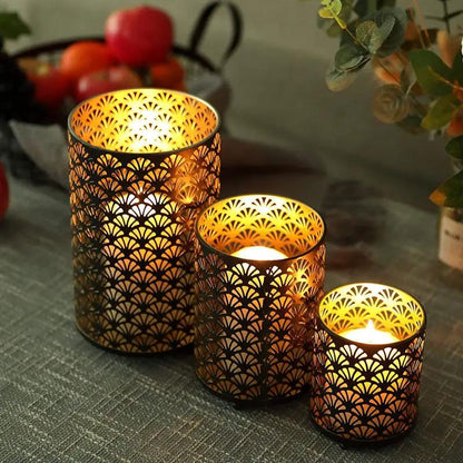 Metal hurricane holders, decorative candle lanterns, set of 3 by JHY DESIGN with gold-bronze perforated fan pattern.