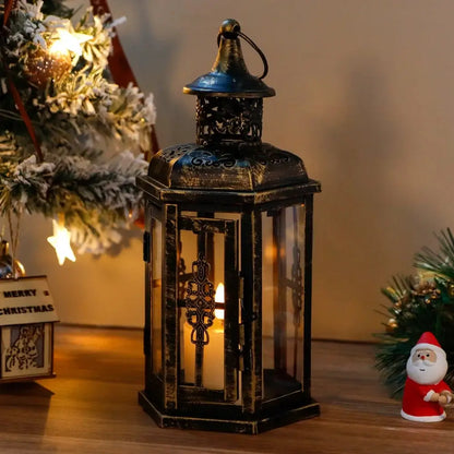 10-inch decorative candle lantern by JHY DESIGN, black distressed metal with glass panels lit by candlelight.