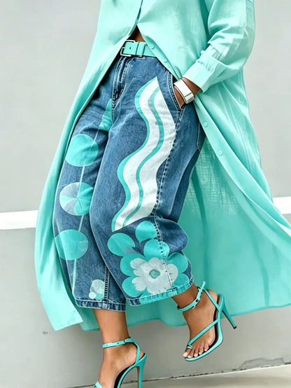 Green wide-leg mid-rise Capri jeans with teal side stripe and floral denim print