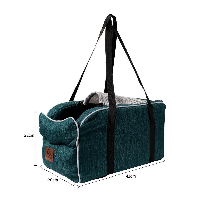 AdTec car travel pet bag in teal breathable fabric with black straps; measures 42cm × 22cm × 20cm.