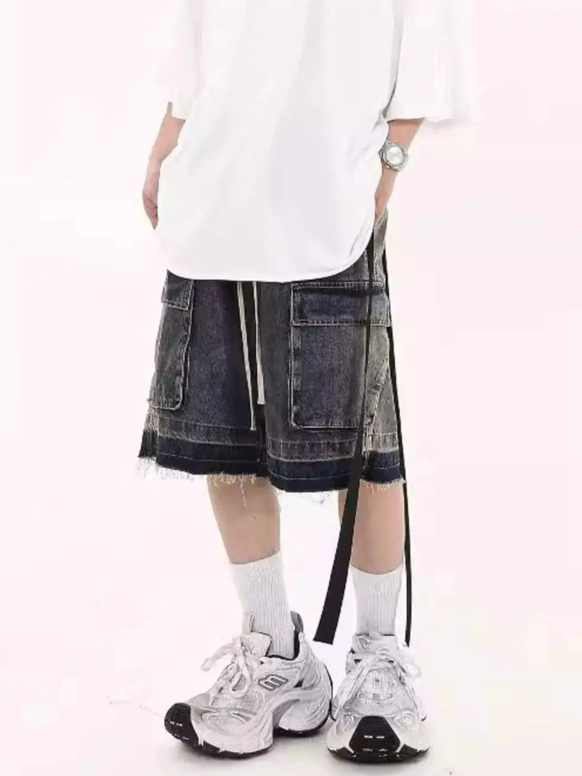 Mens loose-fit cargo denim shorts with drawstring and front zipper, dark wash, multiple pockets.