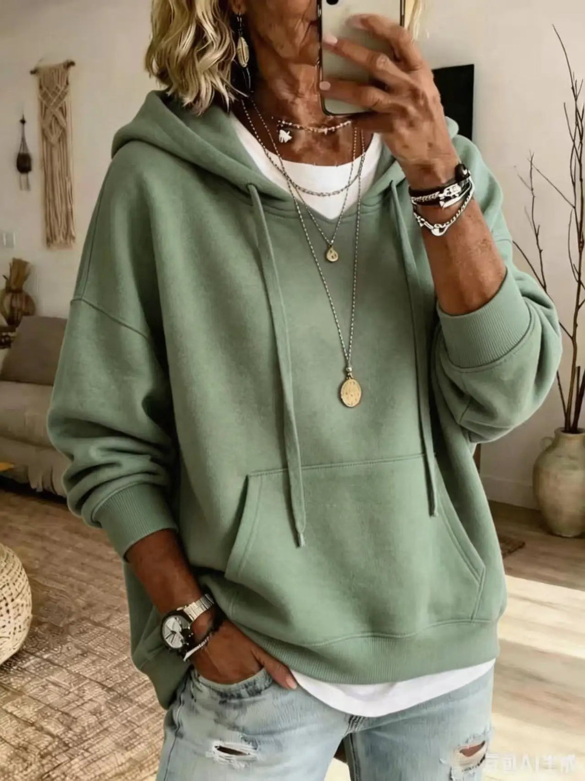 Womens casual loose-fitting sage green hoodie with front pockets and drawstrings