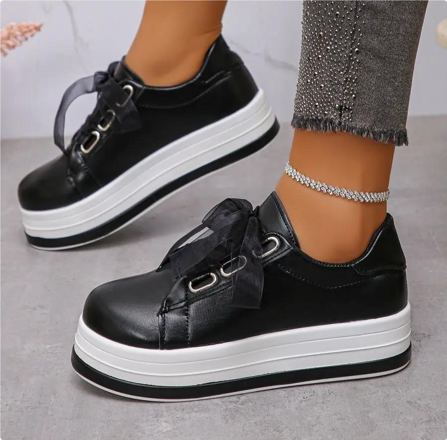AdTec black platform lace-up flats with white sole and round toe, pair shown.
