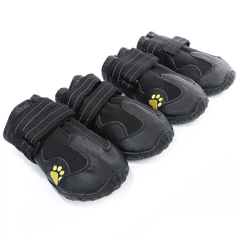 Pet dog foot cover waterproof dog boots; four black boots with Velcro straps and yellow paw print accents