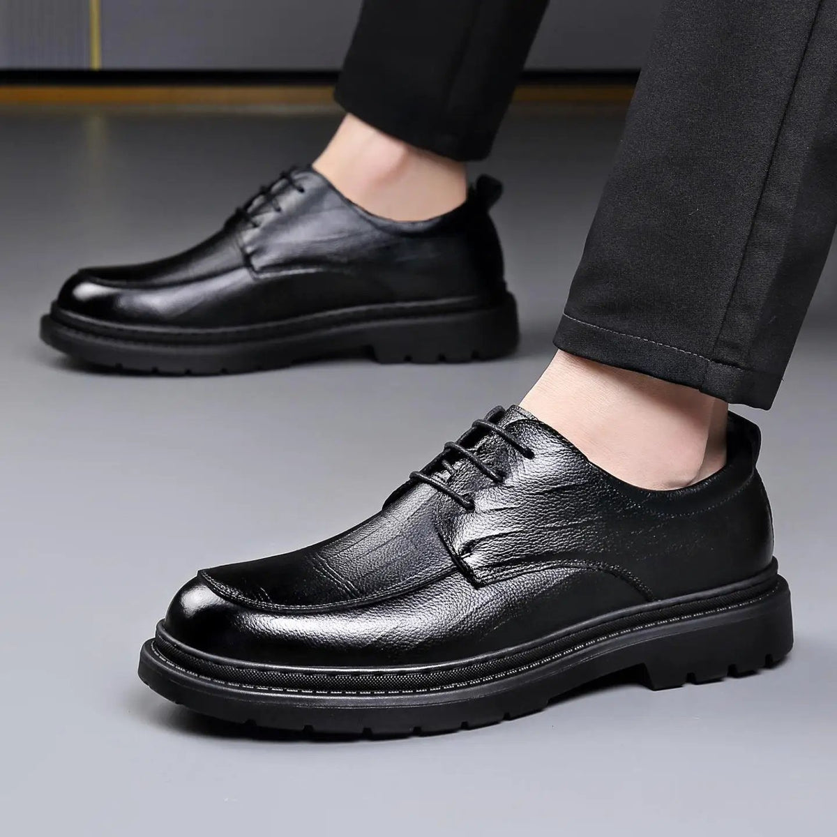 Men's black leather lace-up dress shoes with a chunky sole