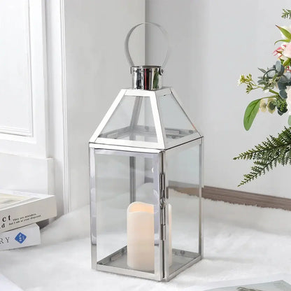 16-inch high decorative lantern with glass panels and chrome metal frame, candle inside