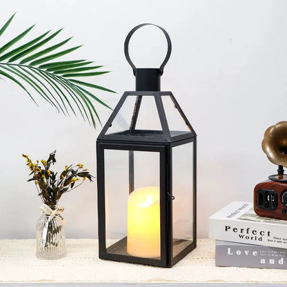 16-inch High Decorative Lantern with black metal frame, glass panels and glowing candle