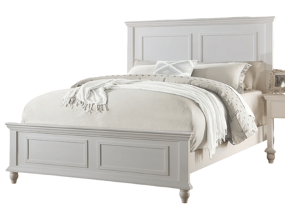 White queen-size bed with a high panel headboard and paneled footboard, dressed in cream bedding for a serene bedroom.