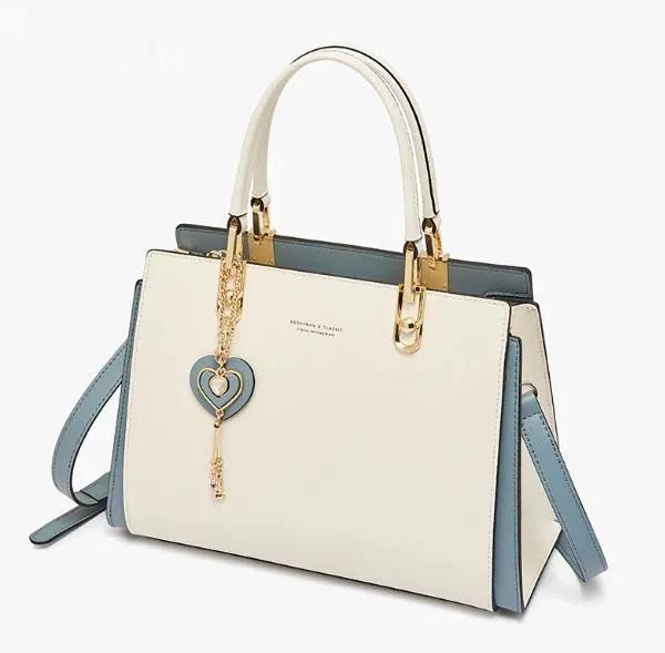 AdTec tote bag in ivory with blue side panels and gold-tone hardware