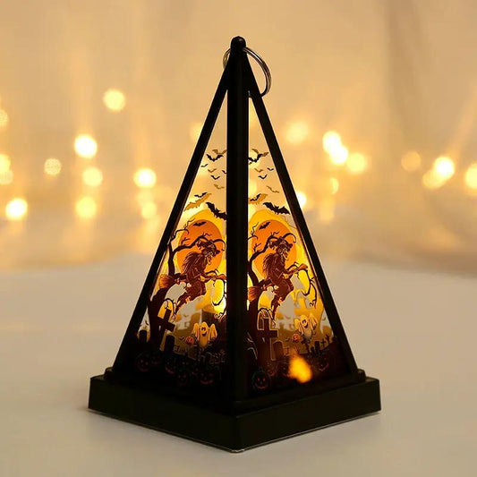 Pumpkin lantern nightlight by AdTec with witch silhouette inside a black triangular frame for desktop Halloween decor