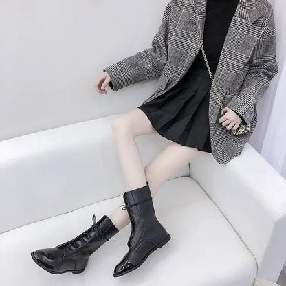 Mid-calf waterproof platform boots, black with lace-up front and patent toe cap