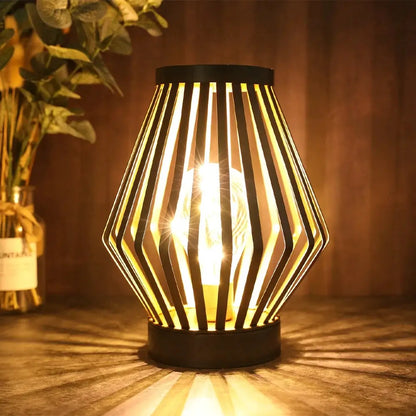 8.7”H Diamond-shaped battery-powered table lamp by JHY DESIGN with striped metal frame and warm glow.