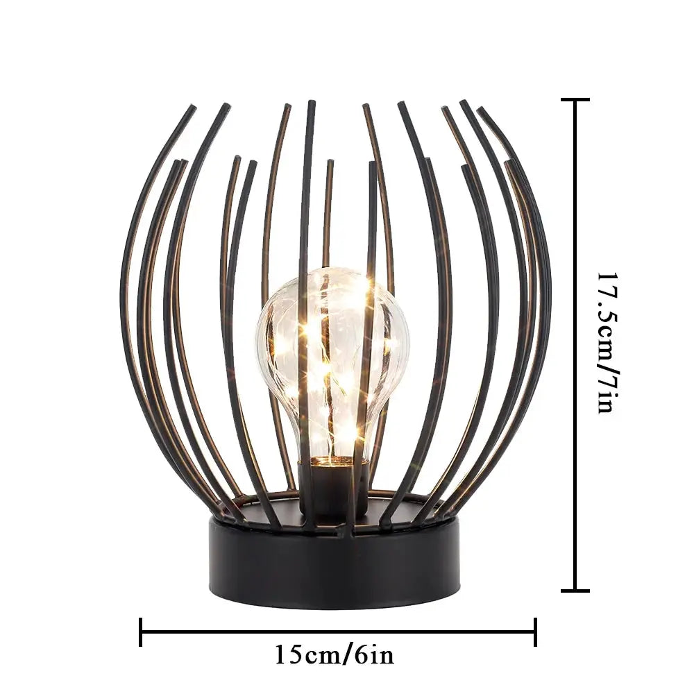 7-inch tall battery-powered table lamp by JHY DESIGN with black wire-frame cage and clear bulb